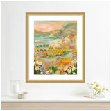 Framed landscape painting depicting vibrant wildflowers in the foreground with hills and a body of water under a soft pastel sky.