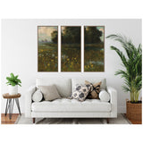 Three-panel framed canvas artwork depicting a meadow with yellow cowslips under a cloudy sky and tall dark trees, displayed above a white sofa with patterned pillows.