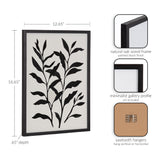 Rectangular black-painted natural oak frame holding a botanical print of black foliage silhouettes on a white background, with sawtooth hangers for versatile mounting.