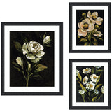 Moody Whites Floral No.
2 3 Piece Framed Wall Art arranged on a pale wall above a sofa with shelves