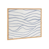Framed print featuring simple, elegant wavy blue lines on a white background with a light wood frame, suggesting a coastal wave pattern.