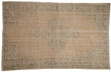 5.5x8.5 Vintage Distressed Oushak Carpet showing starburst medallion and arabesque border in muted greens and beige