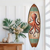 Hand-painted surfboard wall art featuring a detailed red octopus with tribal patterns on a natural wood background accented by green and white geometric bands