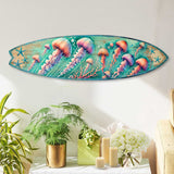 Elongated wooden surfboard-shaped wall art featuring colorful jellyfish and starfish on a teal and brown distressed background, hanging above green plants and candles.