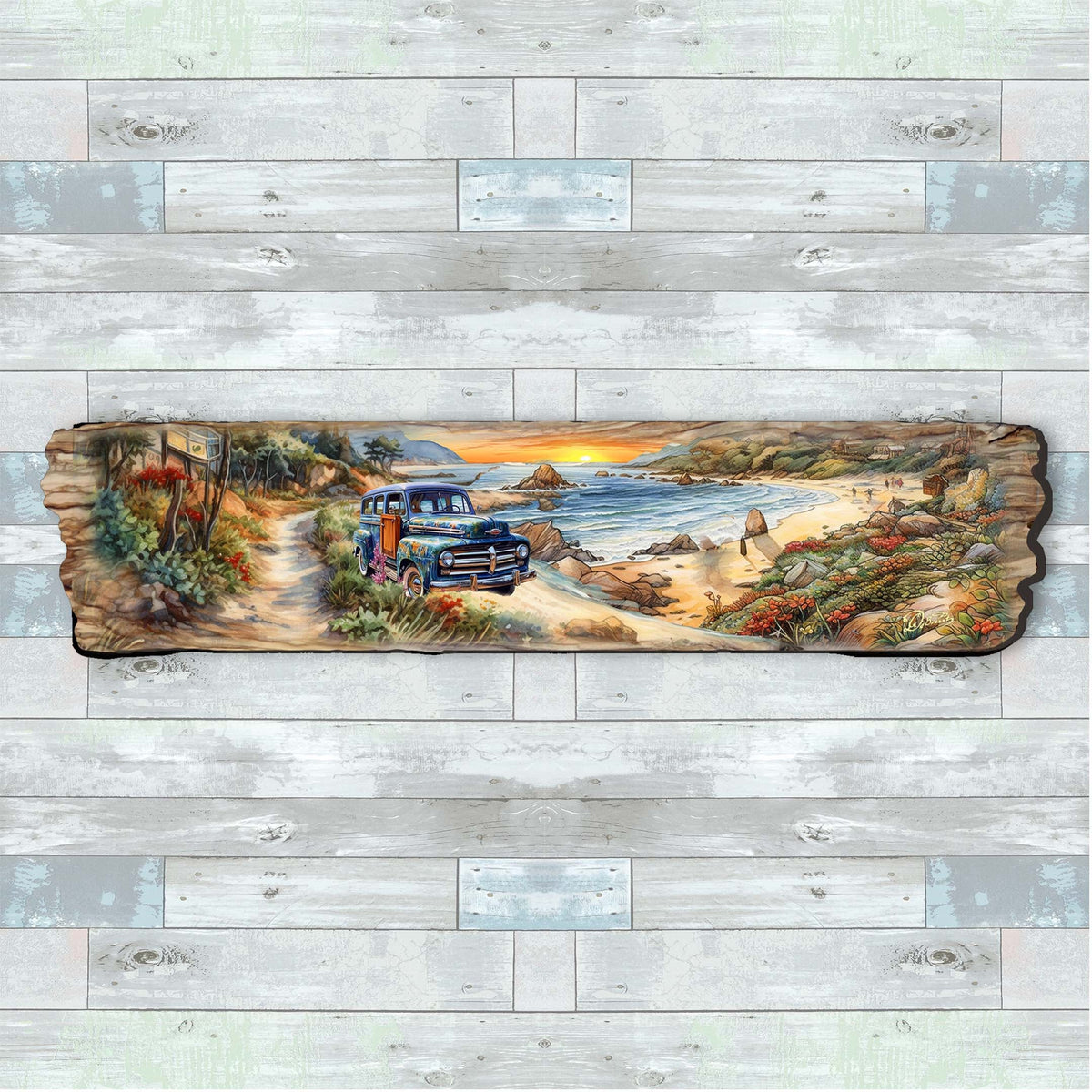 Hand-painted wooden plaque showing a vintage blue truck on a dirt road along a rocky coastline with the sun rising over the ocean, surrounded by colorful coastal vegetation.