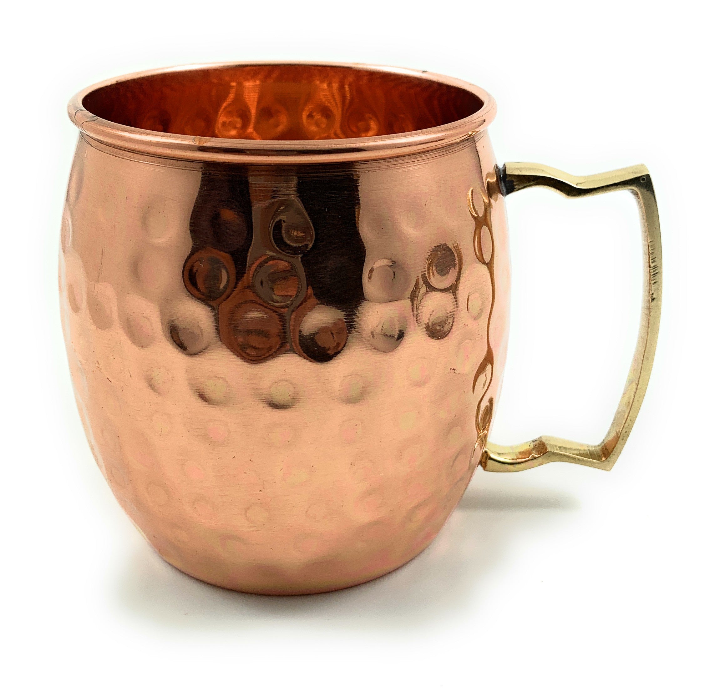 Two hammered copper Moscow Mule mugs with golden brass handles on a light background