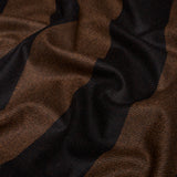 Close-up of Hemlock woven pillow cover showing soft fabric with broad vertical brown and black stripes and subtle diagonal weaving texture.