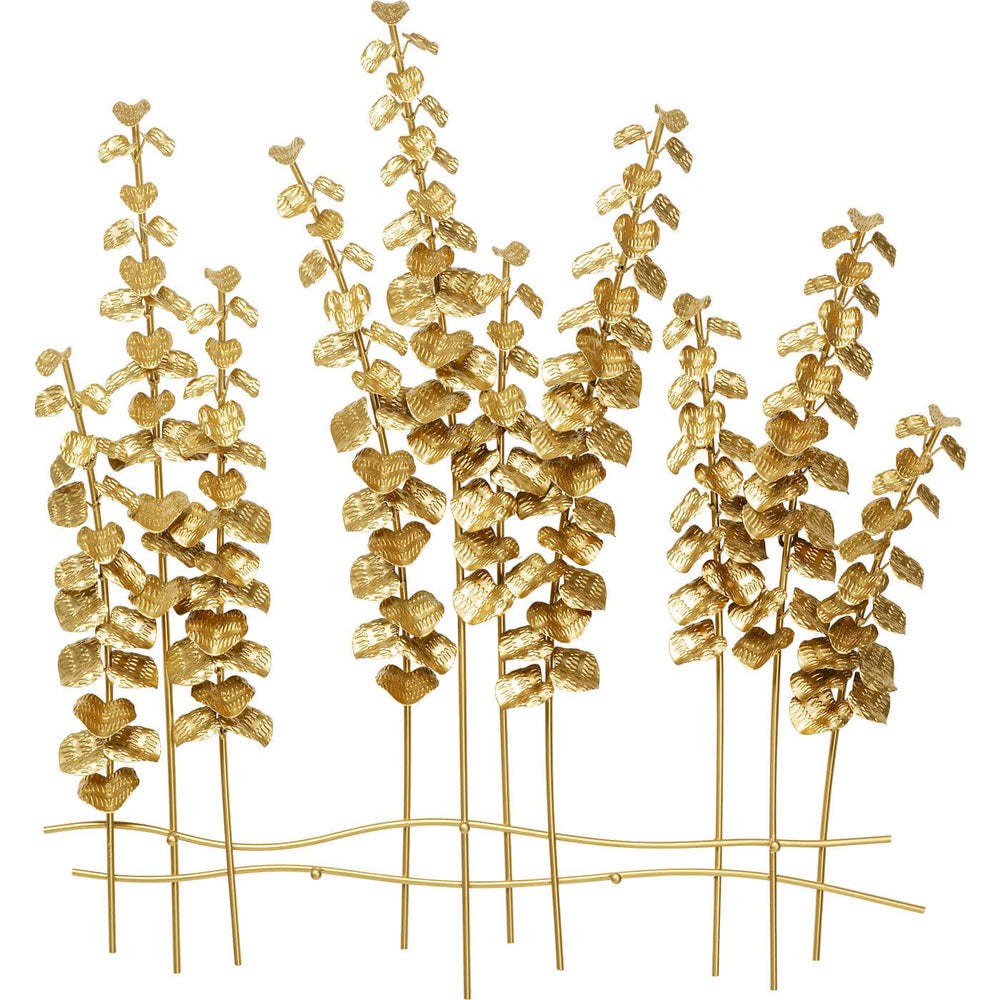 Wall-mounted coat rack with golden branches and leaf motifs against a white wall