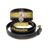 Black and gold snake-patterned collar and matching leash with a pink Swarovski crystal heart-shaped locket on the collar's front strap.