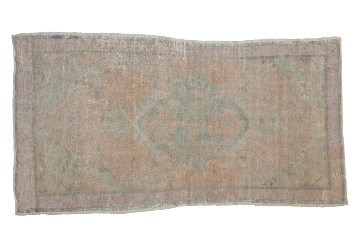 2.5x4.5 Vintage Distressed Oushak Rug with center medallion and floral motifs in muted colors