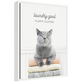 Framed canvas art featuring a playful cat and laundry theme, titled 'Sylvie Cat Laundry Goals' by Amy Peterson