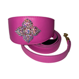 Bright pink strap with a wide section embellished with a square cluster of iridescent rhinestones and gold-toned hardware at one end
