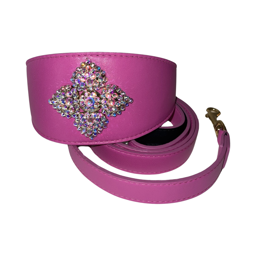 Bright pink strap with a wide section embellished with a square cluster of iridescent rhinestones and gold-toned hardware at one end