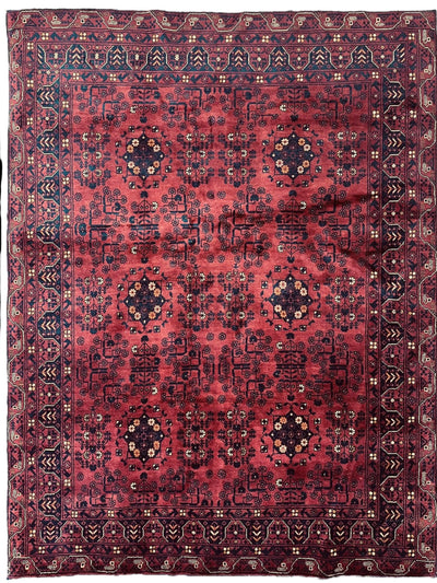Afghani Area Rug I Turkoman Khal Mohammadi 4’9” x 6’2” displayed on wood floor with fringe edges visible
