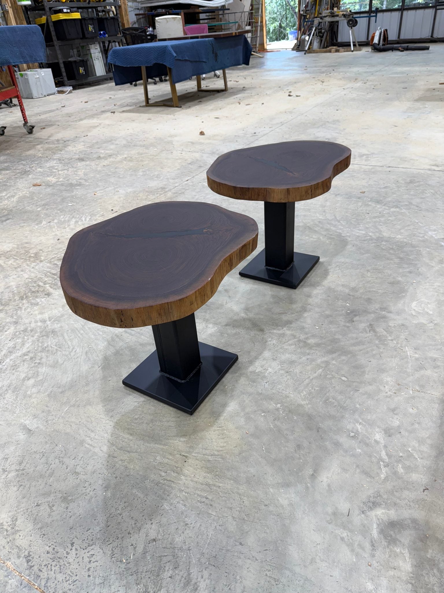 Walnut Cookie Side Tables with thick steel bases, handcrafted by Sasquatch Tables LLC