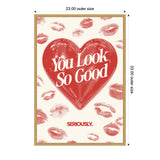 Wall art print with a large red heart containing bold white text saying 'You Look So Good' surrounded by red lipstick kiss marks on a cream background.