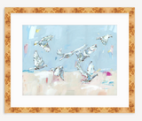 Fine art print depicting seven white doves in flight against a soft blue and beige abstract background, framed in a light wood frame.