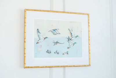 Taking Off Mallard Ducks fine art print by Chelsea McShane Art, featuring mallard ducks taking flight over marshland.