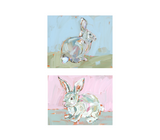 Bunny Hunnies Fine Art Print featuring stylized pink and blue rabbits, framed in white