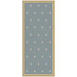 Tall rectangular blue fabric panel with evenly spaced small white botanical block print motifs framed in light wood.
