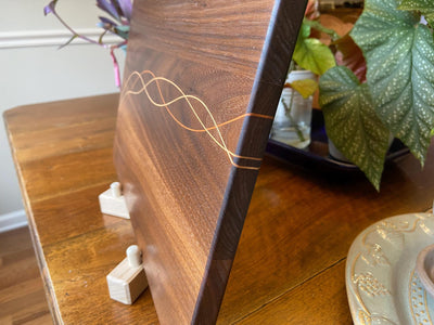 Handcrafted Walnut charcuterie board with Cherry and Maple decorative banding