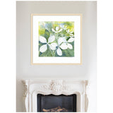 Watercolor painting of white hydrangea flowers with green leaves and yellow-green background, framed in light wood and hung above an ornate white fireplace.