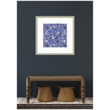Framed square artwork featuring intricate blue and white floral patterns, hung on a dark gray wall above a rustic wooden bench with two woven baskets underneath.