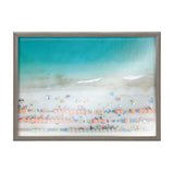 Aerial view of a beach with turquoise water, sandy shore, and rows of colorful umbrellas and beach towels arranged in neat lines, framed in wood.