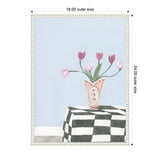 Painting of a pink vase holding six pink tulips on a black-and-white checkered tablecloth against a pale blue background, framed in white with decorative beading.