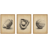 Three framed sepia-toned sketches of sports equipment: an American football, a baseball glove holding a baseball, and a basketball, each centered and shaded for depth.