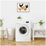 Framed canvas above a white front-loading washing machine features stylized chickens in black, orange, yellow, and brown on a light background.