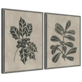 Two framed canvas artworks depicting winter holly leaves and berries in monochrome with textured backgrounds
