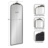Tall arched mirror with an antique black frame and ornate crown detail at the top, measuring 58 inches high and 18 inches wide, with D-ring hangers on the back.