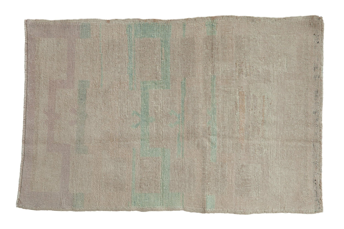 2.5x4 Vintage Distressed Tulu Rug in pale dusty blue, mauve, and silver tones with botanical motif