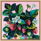 Vibrant painting of ripe and unripe strawberries with green leaves and small white flowers against a soft pink background, framed in light wood.
