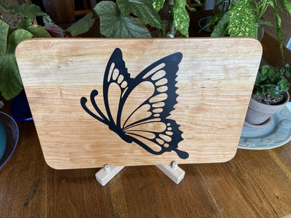 Cherry wood charcuterie board with butterfly-shaped resin inlay