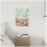 Framed canvas painting of a pastel-hued beach with colorful umbrellas under a swirling turquoise and pink sky, hanging above a rustic wooden nightstand with books and a white cup.