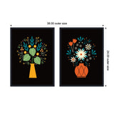 Two framed canvas prints each displaying a stylized floral arrangement on black backgrounds; left with yellow vase and mixed green, yellow, blue flowers, right with red vase and white, blue, orange flowers.