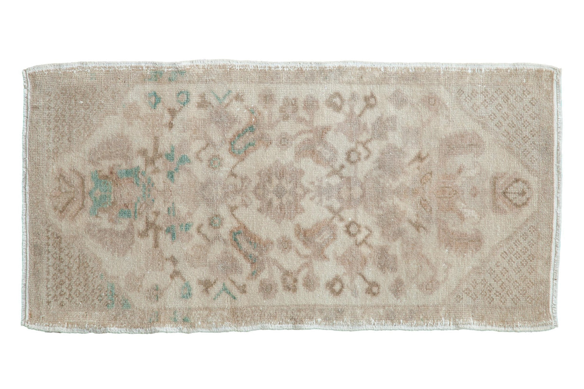 Vintage distressed Oushak rug mat runner with floral and arabesque patterns in ivory, seafoam green, and beige tones.