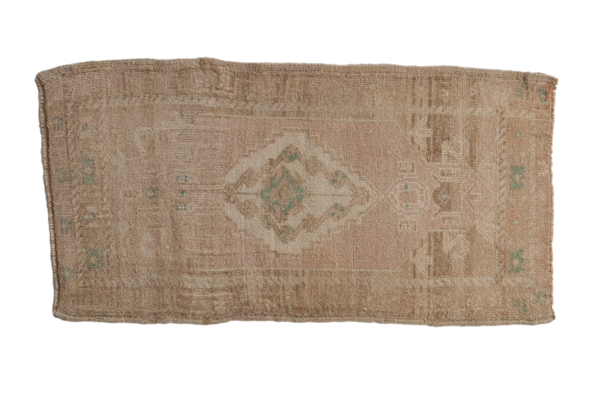 Vintage distressed Oushak rug mat runner with muted floral medallion pattern in blush, teal, seafoam green, and antique ivory tones.