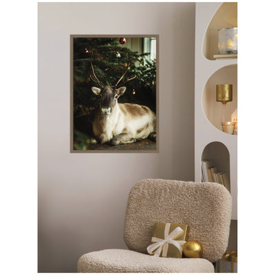 Sylvie Framed Canvas Reindeer Sitting Under a Christmas Tree by Michael Schauer