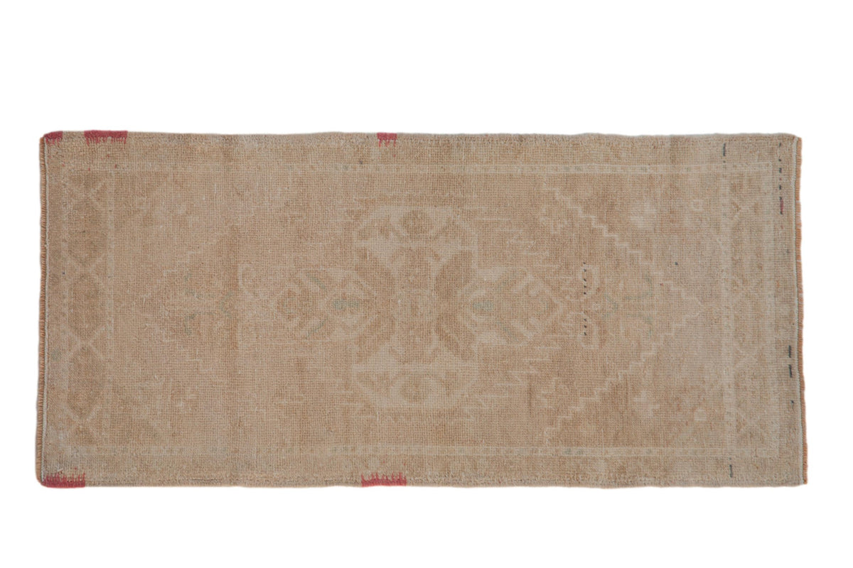 2x4 Vintage Distressed Oushak Rug Runner with beige and mint green floral pattern and scalloped medallion