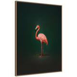 Vivid pink flamingo standing sideways against a dark green gradient background in a framed canvas print with a woven-texture frame.