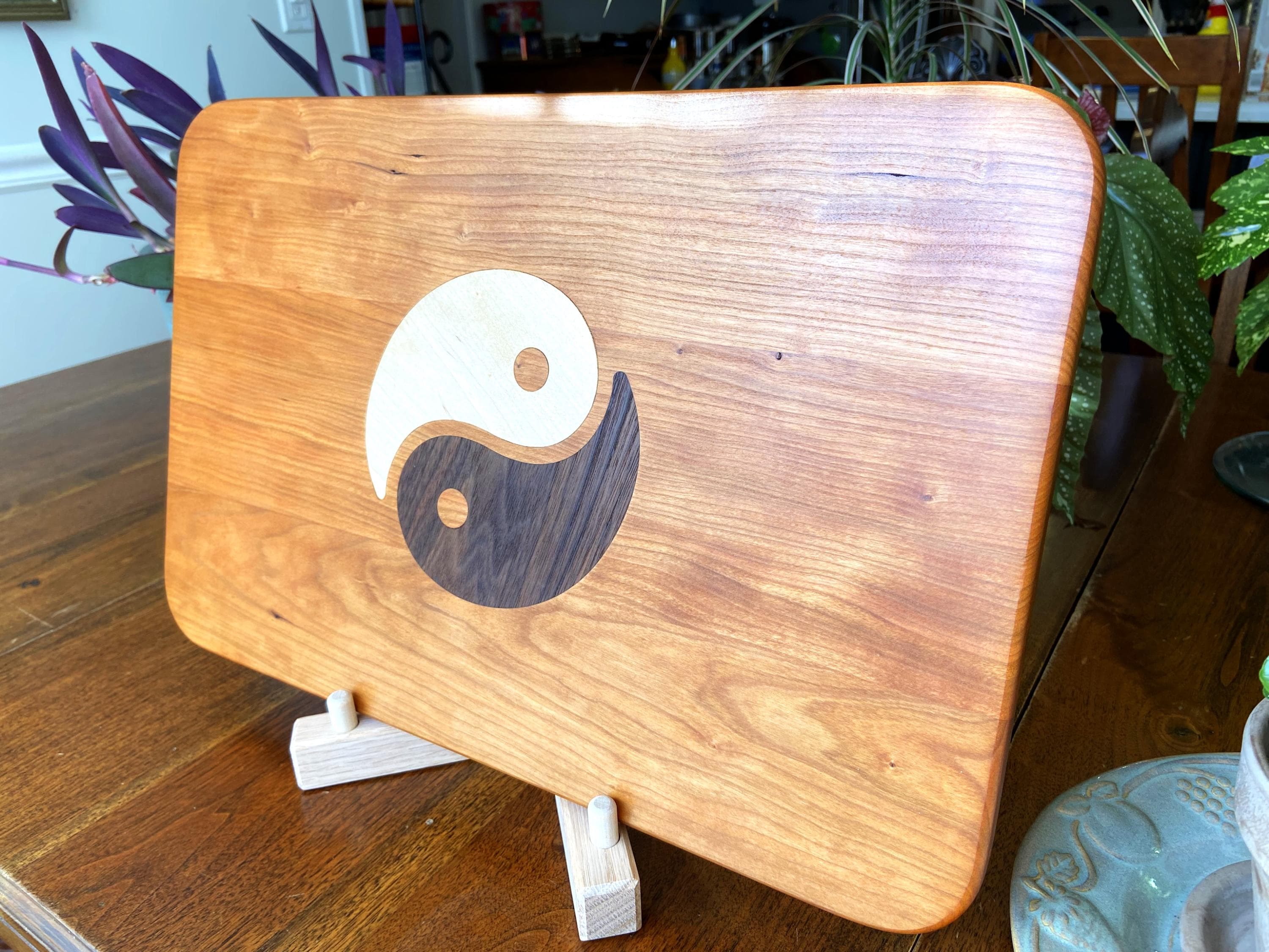 Cherry wood charcuterie board with Yin Yang inlay of Maple and Peruvian Walnut