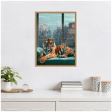 Framed canvas of a tiger lounging on a teal sofa with a New York City skyline, including the Empire State Building, visible through large windows behind it.