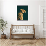 Framed canvas of a gilded cheetah profile on dark green background above wooden bench with white cushions in minimalist room with plant and round woven rug