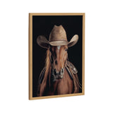 Close-up of a brown horse wearing a weathered tan cowboy hat and leather saddle against a black background, framed in light wood.