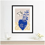 Framed wall art print with a royal blue vase holding blue botanical shapes, set against beige and textured cream backgrounds with a beige circle featuring black abstract lines.