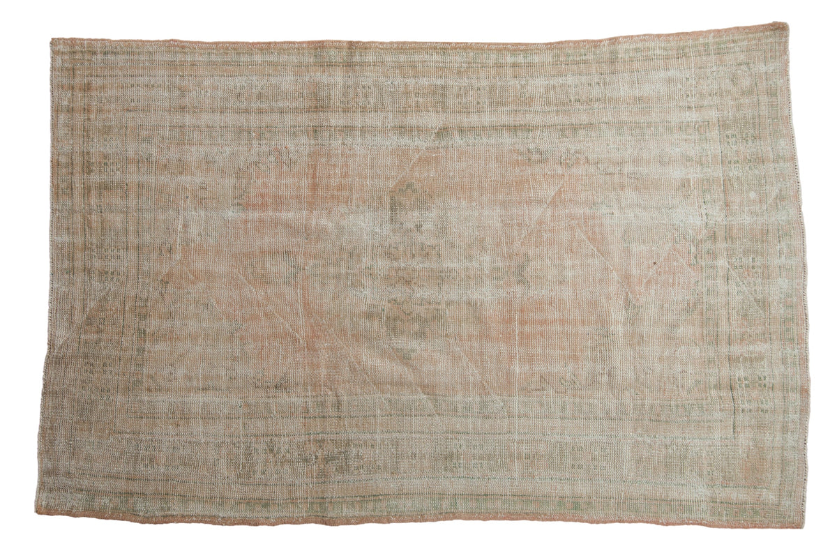 5x7.5 Vintage Distressed Oushak Rug showing center medallion and muted pale pink, ivory, and seafoam green colors