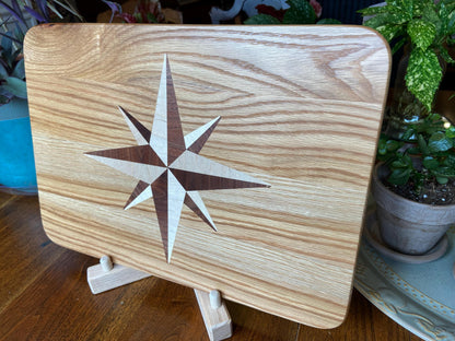Handcrafted white oak charcuterie board with compass rose inlay